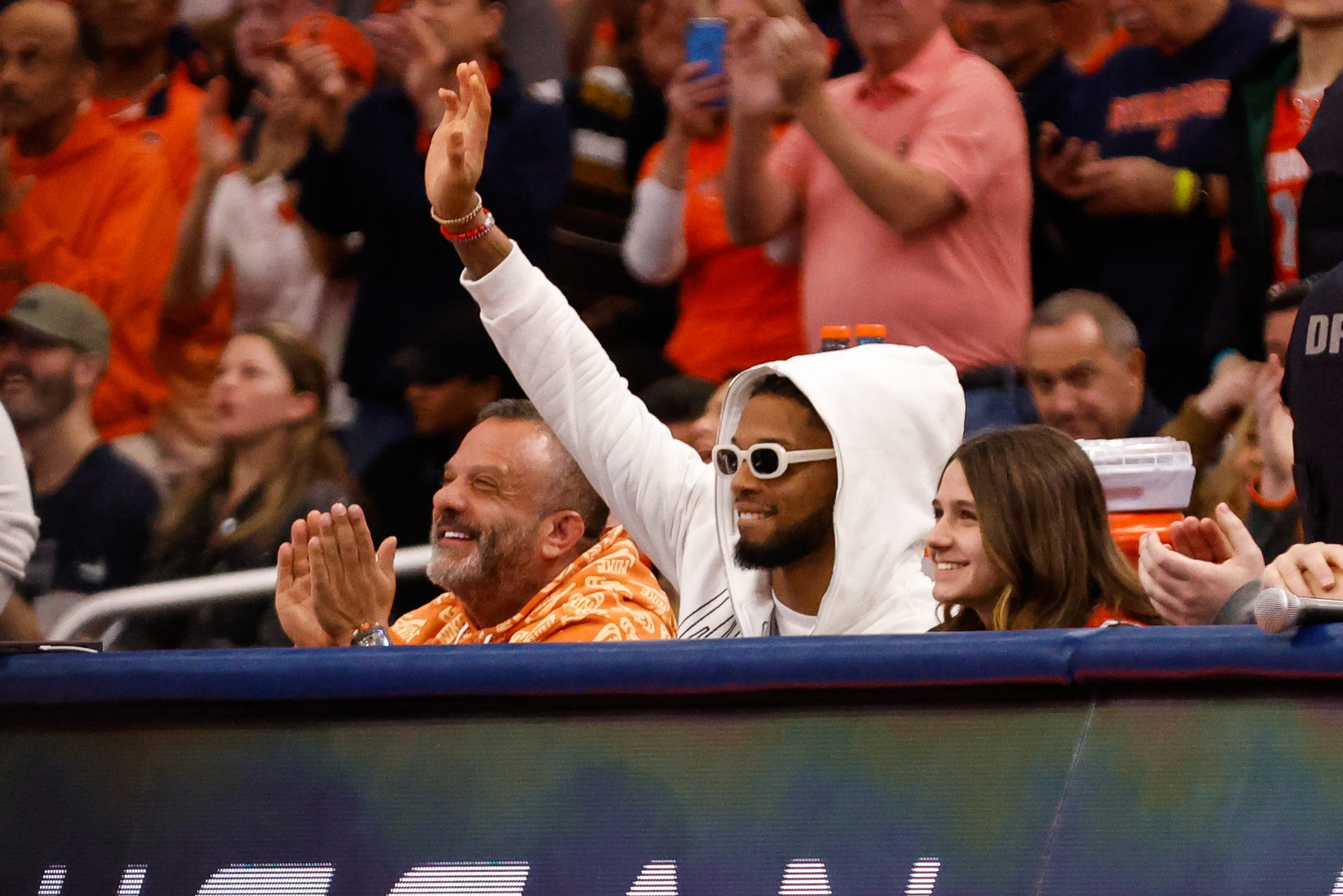 Buffalo Bills' safety Damar Hamlin waves from the sidelines during a Syracuse men's basketball against Duke on Saturday, February 18, 2023 at JMA Wireless Dome.